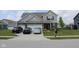 Inviting home with a well-manicured lawn, wide driveway, and a two-car garage at 9068 Thames Dr, Avon, IN 46123