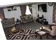 Cozy living room featuring elegant furniture, a large TV, and a patterned rug at 9068 Thames Dr, Avon, IN 46123