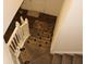 Carpeted staircase with treads leading to a front door with hardwood flooring and a decorative 'HOME' mat at 9068 Thames Dr, Avon, IN 46123