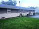 Back exterior of the home with well maintained yard and mature landscaping at 9470 N Old Port Royal, Martinsville, IN 46151