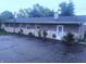 Rear exterior view of the home showing lawn, patio, and landscaping at 9470 N Old Port Royal, Martinsville, IN 46151