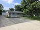Charming single story home featuring a spacious driveway and mature shade trees in the front yard at 9470 N Old Port Royal, Martinsville, IN 46151