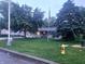 Ranch home with large front yard, mature trees, and American flag at 9470 N Old Port Royal, Martinsville, IN 46151