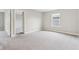 Bedroom featuring neutral walls, carpet flooring, and natural light from windows and open doorway at 9498 Tobin Cir, Avon, IN 46123