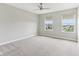 Bedroom featuring neutral walls, carpet flooring, and windows bringing in natural light and view of neighborhood at 9498 Tobin Cir, Avon, IN 46123