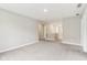 Hallway with neutral walls, carpet flooring, white trim, and access to other rooms and bedrooms at 9498 Tobin Cir, Avon, IN 46123
