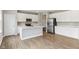 Modern kitchen featuring white cabinets, a stainless steel refrigerator, and an island at 9498 Tobin Cir, Avon, IN 46123