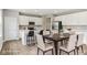 Well-lit kitchen with white cabinets, stainless steel appliances, and bar stool seating at 9498 Tobin Cir, Avon, IN 46123