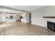 Spacious open-concept living room features a fireplace and an adjacent kitchen area at 9498 Tobin Cir, Avon, IN 46123