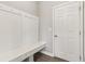 Mudroom area with a built-in bench, coat hooks, and a door leading to another part of the house at 9498 Tobin Cir, Avon, IN 46123