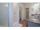 Modern bathroom with tiled shower, granite countertops, and dual sinks at 9728 Junction, Fishers, IN 46037