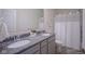 Bathroom features a double vanity with granite countertop and a shower with curtain at 9728 Junction, Fishers, IN 46037