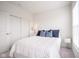 Comfortable bedroom with a bed, white nightstand, and sliding closet doors at 9728 Junction, Fishers, IN 46037