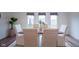 Bright dining room featuring a wooden table, white chairs, and natural light at 9728 Junction, Fishers, IN 46037