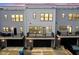 Townhome exterior features private balconies, a black garage door, and a clean, modern design at 9728 Junction, Fishers, IN 46037