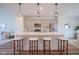 Bright kitchen featuring modern stainless steel appliances, quartz countertops, and a center island at 9728 Junction, Fishers, IN 46037
