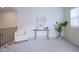 Bright upper landing area with shiplap wall, decor table, and cozy armchair at 9728 Junction, Fishers, IN 46037