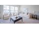 Cozy living room with a comfortable sofa, armchairs, coffee table and large windows at 9728 Junction, Fishers, IN 46037