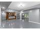 Open basement featuring a bar area with wooden cabinets and shelving, plus space for recreation and entertainment at 9985 Ford Valley Ln, Zionsville, IN 46077