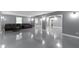 A finished basement offers a comfortable seating area with a leather sofa, perfect for relaxation at 9985 Ford Valley Ln, Zionsville, IN 46077