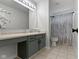 Bathroom featuring a vanity area and a shower with a modern curtain at 9985 Ford Valley Ln, Zionsville, IN 46077