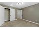 Neutral bedroom with carpeted floor, double door closet, and white trim at 9985 Ford Valley Ln, Zionsville, IN 46077