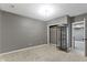 Carpeted bedroom featuring neutral walls, closet and display cabinet at 9985 Ford Valley Ln, Zionsville, IN 46077
