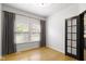 Bright bedroom featuring hardwood floors and large window at 9985 Ford Valley Ln, Zionsville, IN 46077