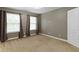 Neutral bedroom with carpeted floor, natural light, and stylish curtains at 9985 Ford Valley Ln, Zionsville, IN 46077