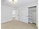 Bright room with closet space and doorway to a view of the stairs at 9985 Ford Valley Ln, Zionsville, IN 46077