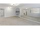 Bonus room with carpet, mirror, and view of adjacent rooms at 9985 Ford Valley Ln, Zionsville, IN 46077
