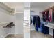 Spacious walk-in closet with ample hanging space, shelving, and full-length mirror at 9985 Ford Valley Ln, Zionsville, IN 46077