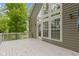 Spacious outdoor deck with white railings and multiple windows to let in natural light at 9985 Ford Valley Ln, Zionsville, IN 46077