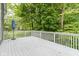 Expansive outdoor deck overlooks a lush green backyard providing a secluded retreat at 9985 Ford Valley Ln, Zionsville, IN 46077