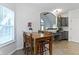Cozy dining area with wooden table and chairs located next to the kitchen at 9985 Ford Valley Ln, Zionsville, IN 46077
