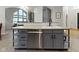 Stylish kitchen island with gray cabinetry, stainless steel appliances, and ample counter space at 9985 Ford Valley Ln, Zionsville, IN 46077