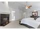 Spacious main bedroom with fireplace and ensuite bathroom at 9985 Ford Valley Ln, Zionsville, IN 46077
