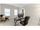 Inviting home office with a gray desk, modern decor, and a comfortable chair for remote work at 9985 Ford Valley Ln, Zionsville, IN 46077