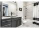 Stylish bathroom with a vessel sink, modern fixtures, and a shower/tub combo at 1 Virginia Ave # 607, Indianapolis, IN 46204