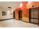 Modern elevator bank featuring colorful accents and tiled flooring at 1 Virginia Ave # 607, Indianapolis, IN 46204