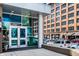 Modern building entrance with glass doors and a view of street parking at 1 Virginia Ave # 607, Indianapolis, IN 46204