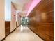 Modern office hallway with wood paneling and accent lighting at 1 Virginia Ave # 607, Indianapolis, IN 46204