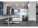 Open concept kitchen features stainless steel appliances, blue and white cabinets and granite countertops at 1 Virginia Ave # 607, Indianapolis, IN 46204