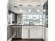 Bright kitchen featuring stainless steel appliances, contemporary lighting, with exterior views at 1 Virginia Ave # 607, Indianapolis, IN 46204
