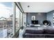 Bright living area with city views from expansive windows, comfortable seating, and modern accents at 1 Virginia Ave # 607, Indianapolis, IN 46204