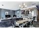 Modern living space with a glass dining table, stylish chairs, and an open concept kitchen at 1 Virginia Ave # 607, Indianapolis, IN 46204