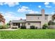 Large backyard with a beautiful lawn, an enclosed patio, and a well-maintained exterior at 10758 Gettysburg Pl, Carmel, IN 46032