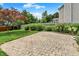 Backyard with brick patio and landscaped garden, ideal for outdoor entertaining at 10758 Gettysburg Pl, Carmel, IN 46032