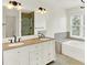 Bathroom features double sinks, granite countertops, walk-in shower and tub at 10758 Gettysburg Pl, Carmel, IN 46032