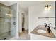 Bathroom features double sinks, granite countertops and a walk-in shower at 10758 Gettysburg Pl, Carmel, IN 46032